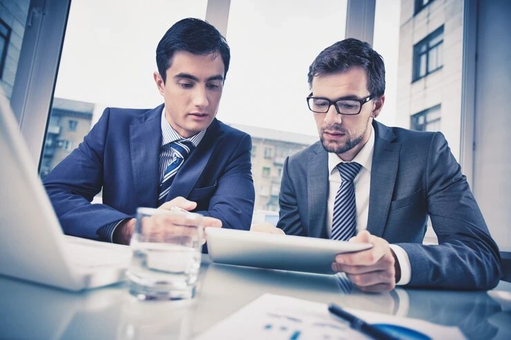 Leading professionals analyzing tax assessment compliance in Dubai